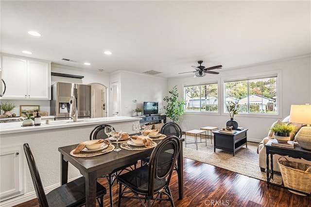 1125 Sheridan Ave Unit 68, Chico, CA 95926 - dining space featuring dark wood finished floors, arched walkways, ceiling fan, recessed lighting, and ornamental molding