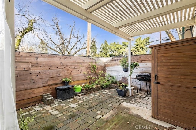 1125 Sheridan Ave Unit 68, Chico, CA 95926 - fenced backyard with a patio area, a pergola, and area for grilling