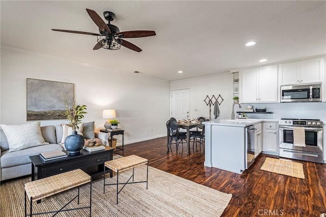1125 Sheridan Ave Unit 68, Chico, CA 95926 - kitchen with stainless steel appliances, white cabinets, dark wood-style floors, open shelves, and recessed lighting