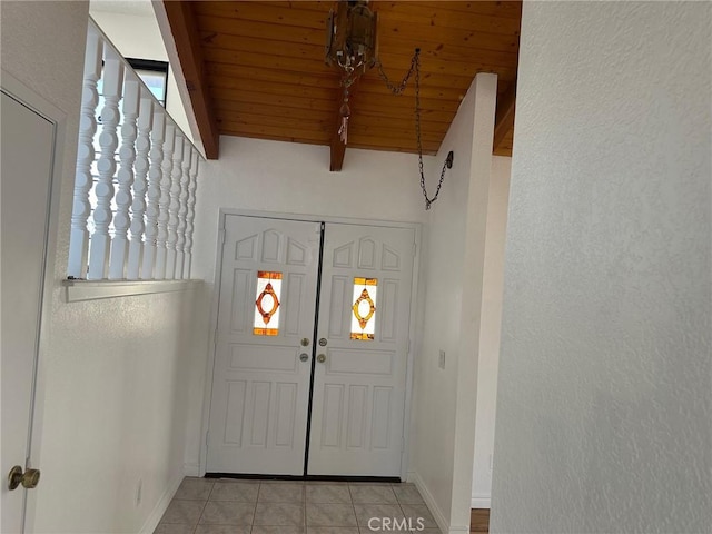 16485 Wintun Rd, Apple Valley, CA 92307 - entryway featuring light tile patterned floors, wooden ceiling, and baseboards