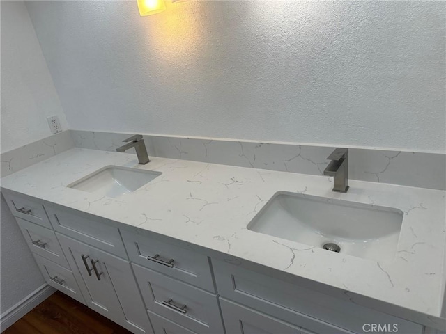 16485 Wintun Rd, Apple Valley, CA 92307 - bathroom featuring double vanity and wood finished floors