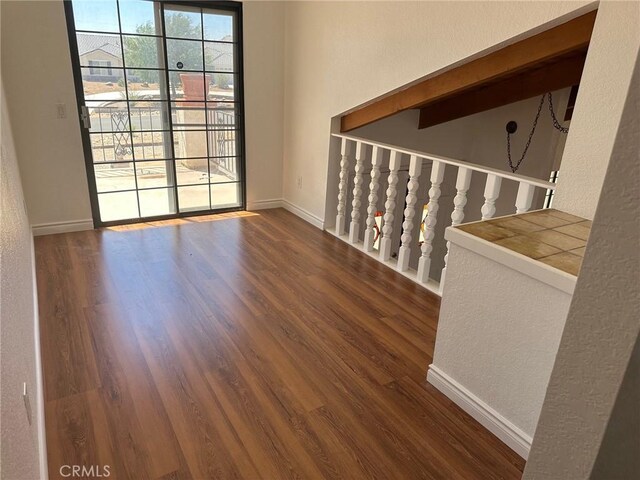 16485 Wintun Rd, Apple Valley, CA 92307 - unfurnished room featuring wood finished floors, baseboards, and a textured wall
