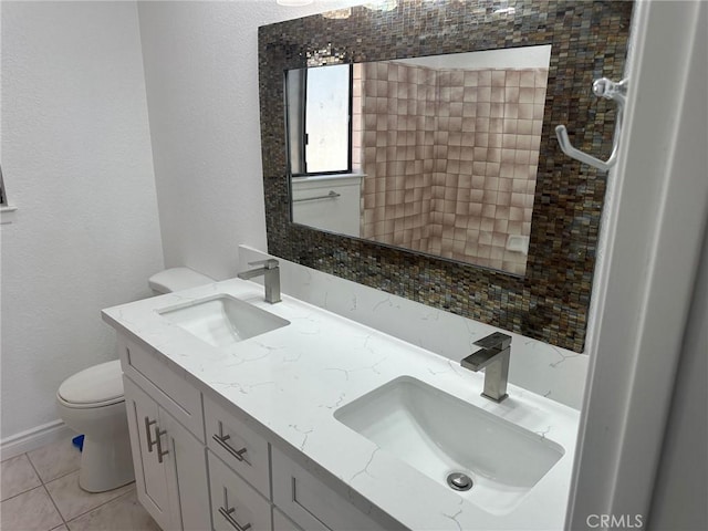 16485 Wintun Rd, Apple Valley, CA 92307 - full bathroom featuring toilet, double vanity, tile patterned floors, baseboards, and a textured wall