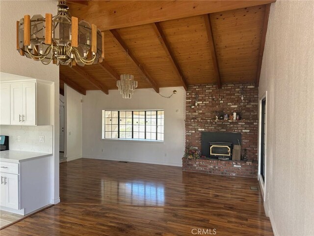 16485 Wintun Rd, Apple Valley, CA 92307 - unfurnished living room with a chandelier, wood finished floors, wooden ceiling with exposed beams, a brick fireplace, and baseboards
