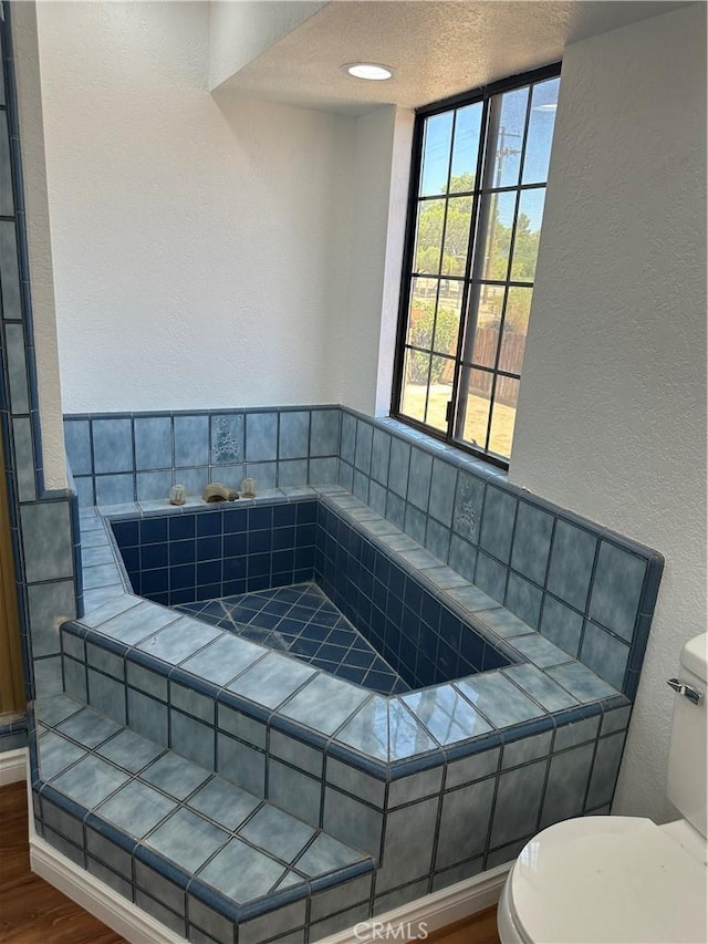 16485 Wintun Rd, Apple Valley, CA 92307 - bathroom featuring toilet, a textured wall, wood finished floors, and a textured ceiling