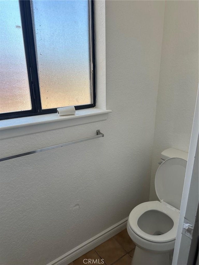 16485 Wintun Rd, Apple Valley, CA 92307 - bathroom with tile patterned floors, toilet, and baseboards