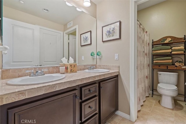 45 Brownstone Way, Aliso Viejo, CA 92656 - bathroom with double vanity, toilet, tile patterned flooring, and baseboards