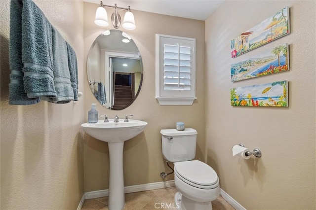 45 Brownstone Way, Aliso Viejo, CA 92656 - half bath featuring toilet, baseboards, a sink, and tile patterned floors