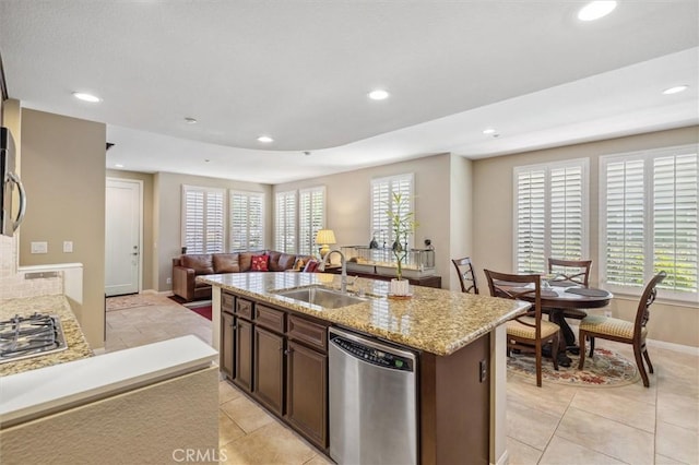 45 Brownstone Way, Aliso Viejo, CA 92656 - kitchen with stainless steel appliances, a sink, recessed lighting, light stone counters, and open floor plan