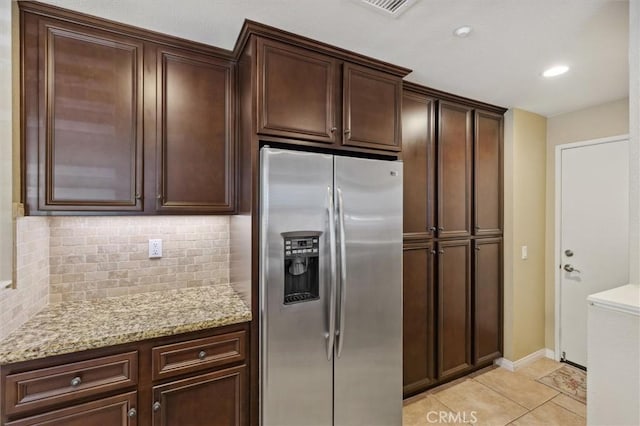 45 Brownstone Way, Aliso Viejo, CA 92656 - kitchen featuring stainless steel fridge with ice dispenser, decorative backsplash, dark brown cabinets, light stone countertops, and light tile patterned flooring