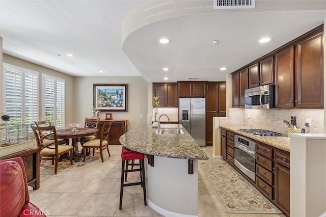 45 Brownstone Way, Aliso Viejo, CA 92656 - kitchen with appliances with stainless steel finishes, a sink, recessed lighting, light tile patterned flooring, and tasteful backsplash