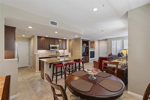 45 Brownstone Way, Aliso Viejo, CA 92656 - dining room with recessed lighting, light tile patterned floors, and baseboards