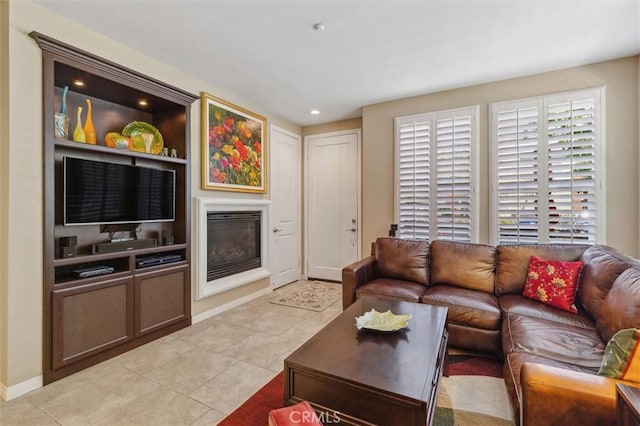 45 Brownstone Way, Aliso Viejo, CA 92656 - living room featuring a glass covered fireplace, light tile patterned floors, baseboards, and recessed lighting