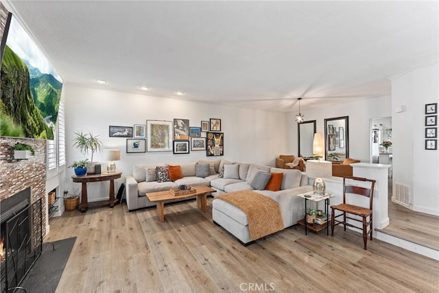 19431 Ranch Ln Unit 101, Huntington Beach, CA 92648 - living area featuring a fireplace, light wood-type flooring, recessed lighting, and baseboards
