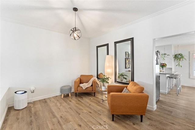 19431 Ranch Ln Unit 101, Huntington Beach, CA 92648 - living area featuring wood finished floors, baseboards, and ornamental molding
