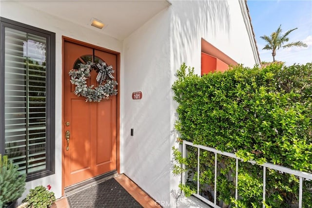 19431 Ranch Ln Unit 101, Huntington Beach, CA 92648 - view of exterior entry featuring stucco siding