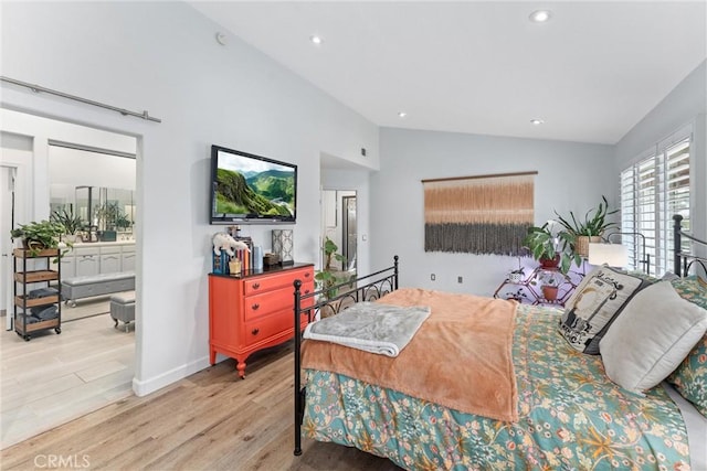 19431 Ranch Ln Unit 101, Huntington Beach, CA 92648 - bedroom with wood finished floors, vaulted ceiling, recessed lighting, ensuite bath, and baseboards