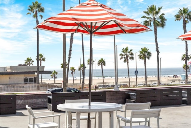 19431 Ranch Ln Unit 101, Huntington Beach, CA 92648 - view of patio / terrace featuring view of water and beach and outdoor dining space