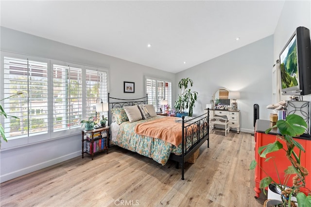19431 Ranch Ln Unit 101, Huntington Beach, CA 92648 - bedroom with light wood finished floors, vaulted ceiling, baseboards, and recessed lighting