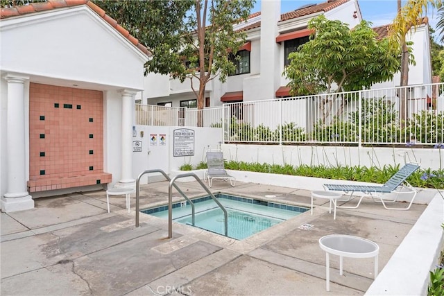 19431 Ranch Ln Unit 101, Huntington Beach, CA 92648 - view of swimming pool featuring a hot tub
