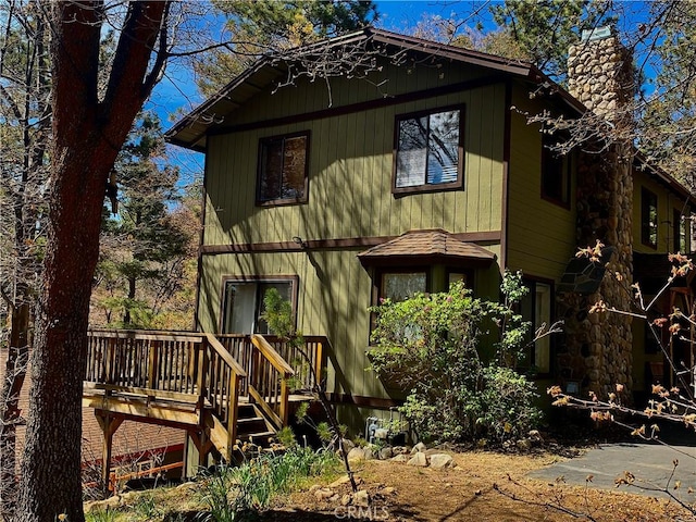 762 Esquimoux Dr, Green Valley Lake, CA 92341 - back of house featuring a chimney and a wooden deck
