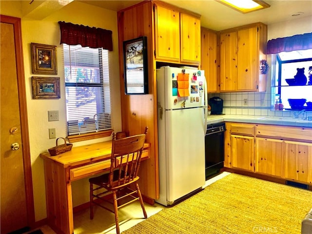 762 Esquimoux Dr, Green Valley Lake, CA 92341 - kitchen with freestanding refrigerator, black dishwasher, tasteful backsplash, and tile countertops