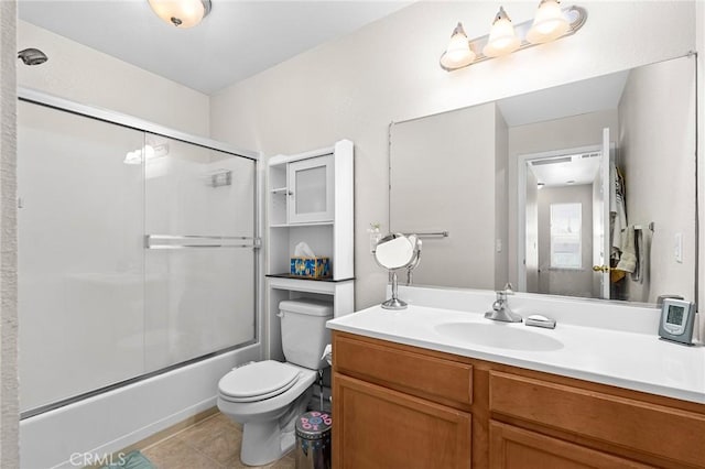 2099 Hartford Dr Unit 7, Chico, CA 95928 - full bath featuring vanity, toilet, bath / shower combo with glass door, and tile patterned floors