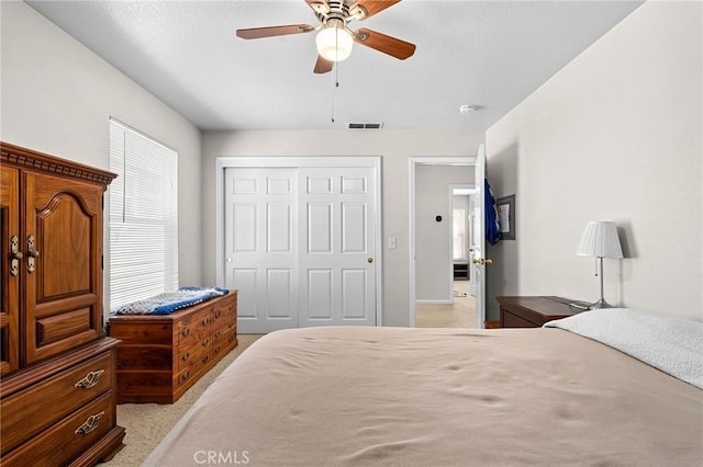 2099 Hartford Dr Unit 7, Chico, CA 95928 - bedroom featuring light colored carpet, a closet, and a ceiling fan