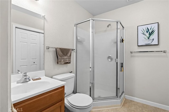 2099 Hartford Dr Unit 7, Chico, CA 95928 - full bath featuring vanity, a stall shower, toilet, baseboards, and tile patterned floors