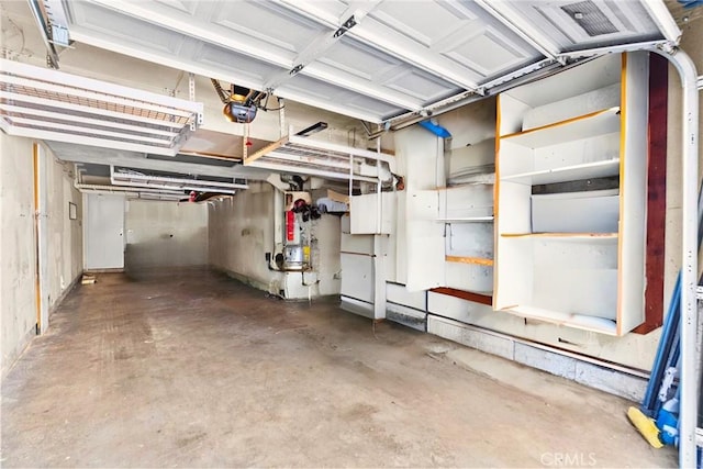 26762 Claudette St Unit 417, Canyon Country, CA 91351 - garage with water heater and a garage door opener
