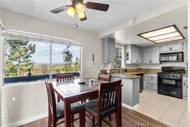 26762 Claudette St Unit 417, Canyon Country, CA 91351 - dining room with a ceiling fan and light wood-style floors