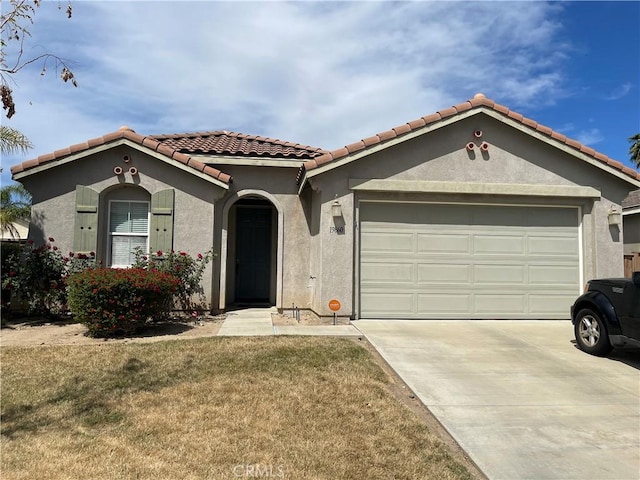 19860 Parkwood Dr, Lake Elsinore, CA 92530 - mediterranean / spanish home with a garage, concrete driveway, stucco siding, a tile roof, and a front lawn