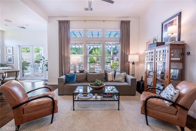 26941 Redwood Bluff Ln, Valencia, CA 91381 - living room featuring french doors, a ceiling fan, wood finished floors, and baseboards
