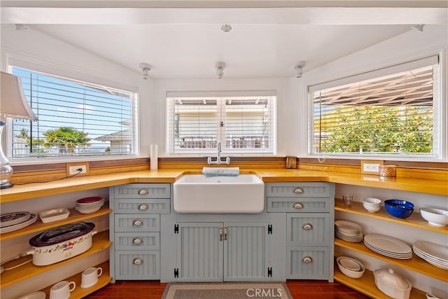418 Tulare Ave, Morro Bay, CA 93442 - kitchen featuring gray cabinetry, a sink, and dark wood finished floors