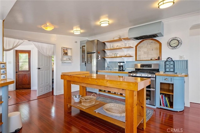 418 Tulare Ave, Morro Bay, CA 93442 - kitchen featuring range with two ovens, exhaust hood, open shelves, wooden counters, and dark wood-type flooring