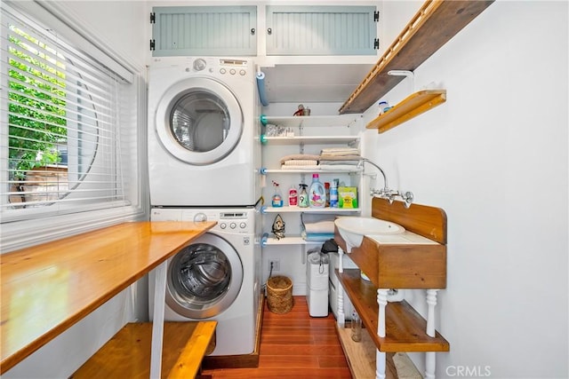 418 Tulare Ave, Morro Bay, CA 93442 - laundry room featuring stacked washer and clothes dryer and wood finished floors