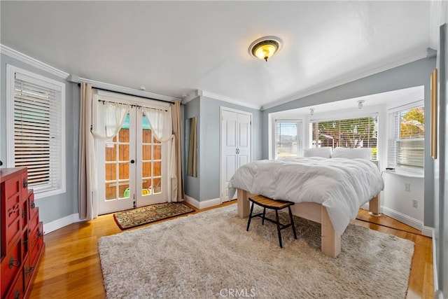 418 Tulare Ave, Morro Bay, CA 93442 - bedroom featuring ornamental molding, french doors, baseboards, wood finished floors, and a closet