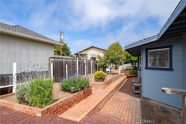 418 Tulare Ave, Morro Bay, CA 93442 - wooden terrace featuring a patio area and a vegetable garden