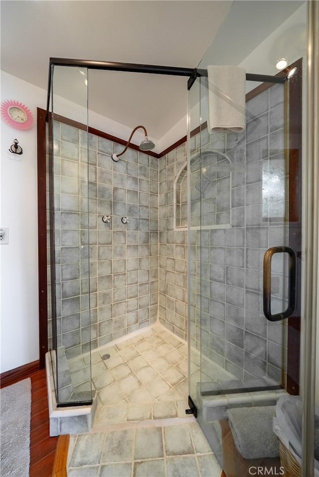 418 Tulare Ave, Morro Bay, CA 93442 - bathroom with a stall shower, wood finished floors, and baseboards