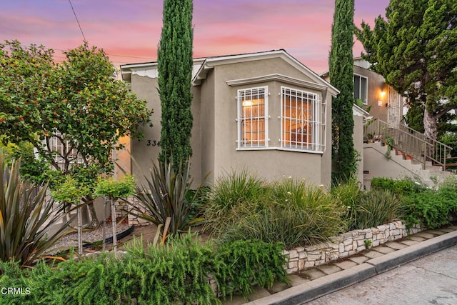 3349 Wood Ter, Los Angeles, CA 90027 - property exterior at dusk featuring stucco siding and stairs