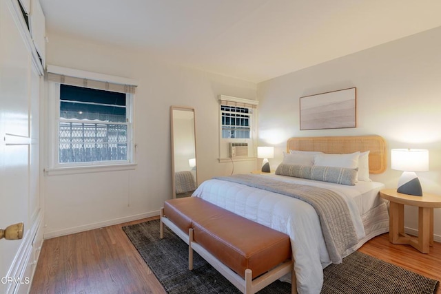 3349 Wood Ter, Los Angeles, CA 90027 - bedroom with wood finished floors, baseboards, and cooling unit
