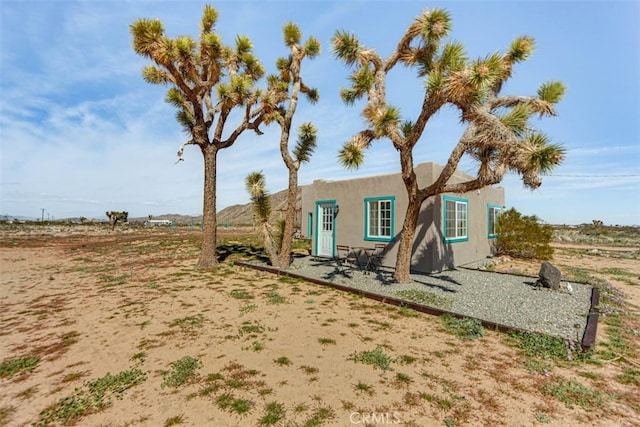 58725 Botkin Rd, Landers, CA 92285 - view of front of home with stucco siding