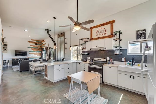 58725 Botkin Rd, Landers, CA 92285 - kitchen with electric range, a peninsula, finished concrete floors, decorative backsplash, and ceiling fan