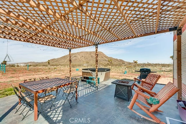 58725 Botkin Rd, Landers, CA 92285 - view of patio / terrace featuring a mountain view, an outdoor fire pit, a pergola, and outdoor dining area