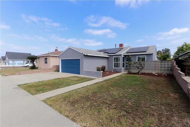 1023 W 186th St, Gardena, CA 90248 - ranch-style house featuring stucco siding, roof mounted solar panels, concrete driveway, and an attached garage