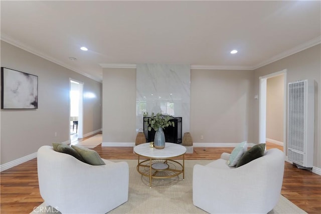1023 W 186th St, Gardena, CA 90248 - living area with a heating unit, ornamental molding, wood finished floors, recessed lighting, and baseboards