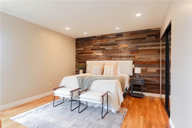 1023 W 186th St, Gardena, CA 90248 - bedroom featuring wooden walls, light wood-type flooring, baseboards, recessed lighting, and an accent wall