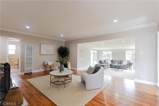 1023 W 186th St, Gardena, CA 90248 - living room featuring a heating unit, plenty of natural light, ornamental molding, wood finished floors, and recessed lighting