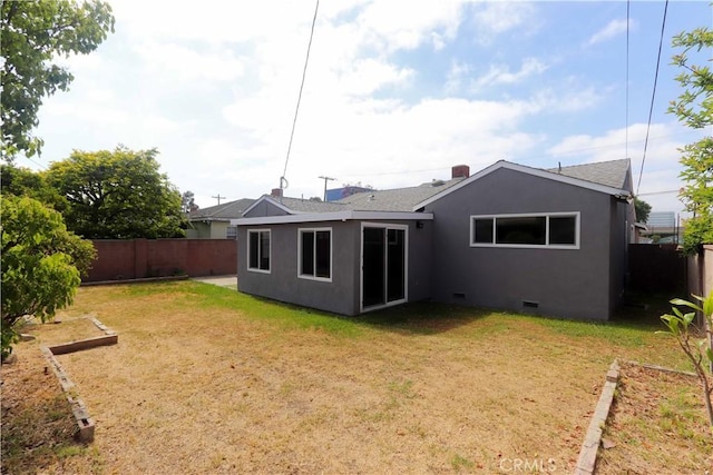 1023 W 186th St, Gardena, CA 90248 - rear view of house with stucco siding, crawl space, and a shingled roof