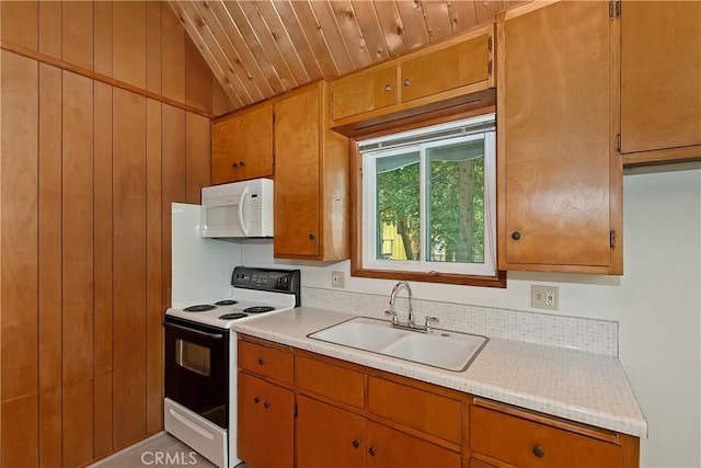 24141 Zell Ct, Crestline, CA 92325 - kitchen featuring electric stove, white microwave, a sink, light countertops, and brown cabinetry